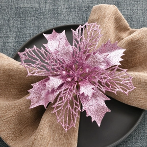 Pink glitter poinsettia napkin ring for elegant Christmas holiday table decoration