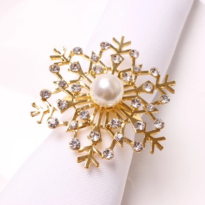 Golden snowflake napkin ring with white pearl and sparkling crystals for Christmas decor