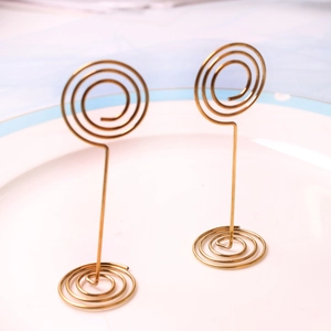 Golden star-shaped stainless steel business card holder with dual spiral base stand