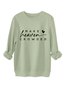 Detailed view of sage green sweatshirt with Make Heaven Crowded text and heart print