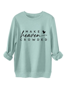 Detail of mint green sweatshirt featuring ribbed cuffs and Make Heaven Crowded print