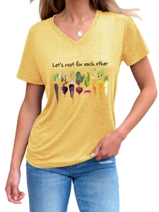 Detail of yellow V-neck t-shirt with Let's root for each other slogan and vegetable print
