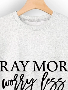 Detailed view of ribbed neckline and Pray More Worry Less print on heather gray sweatshirt