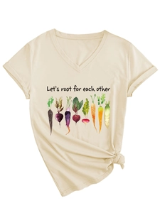 Detail of V-neck apricot tee featuring vegetable print and stylish side knot design