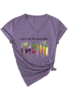 Detail of purple V-neck T-shirt with watercolor root vegetable prints and inspirational text