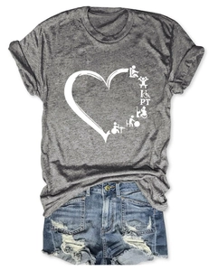 Detail of grey Physical Therapy heart print T-shirt paired with denim shorts