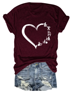 Flat lay of wine red PT heart t-shirt paired with distressed light blue denim shorts