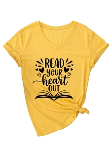 Detail of V-neck ginger yellow t-shirt with knotted hem and READ YOUR heart OUT print