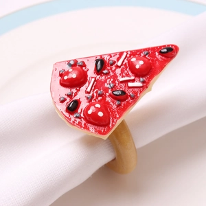 Macro shot of realistic resin pizza napkin ring with colorful toppings on white cloth