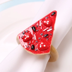 Realistic pizza slice napkin ring holder on white fabric for dining table decor
