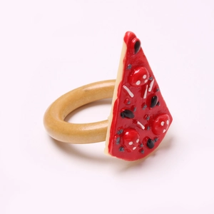 Creative pizza slice napkin ring with realistic toppings on a smooth brown circular band