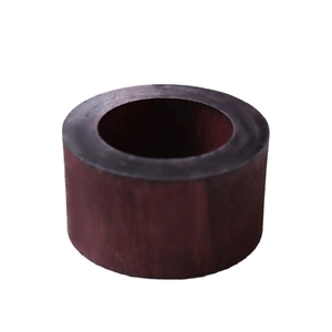 Minimalist dark brown wooden napkin ring with smooth finish and natural grain texture
