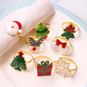 Close-up of assorted Christmas napkin rings with festive Santa, reindeer and tree designs