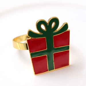 Christmas gift box napkin ring in red and green enamel with golden metal plating
