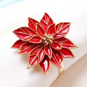 Christmas poinsettia napkin ring with red flower petals and gold metal finish for table