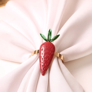 Elegant strawberry napkin ring with red enamel and gold metal for festive table decor