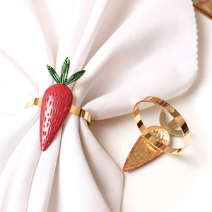 Carrot napkin rings in red and green enamel with golden finish for Thanksgiving table decor