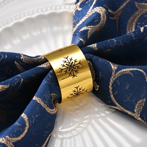 Golden snowflake napkin ring with hollow design for Christmas and wedding table settings