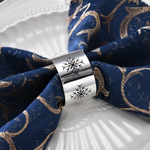 Polished silver snowflake napkin ring with hollow design for Christmas table setting
