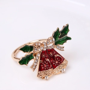 Christmas napkin ring with red bells and crystal bow on a white background