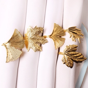 Golden maple leaf metal napkin rings with intricate leaf veins for table decoration