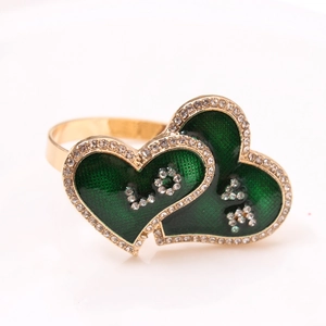 Detail of green enamel double heart napkin ring with LOVE rhinestone embellishment
