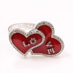 Detail of red dual heart napkin rings with crystal LOVE engraving and silver metal loop