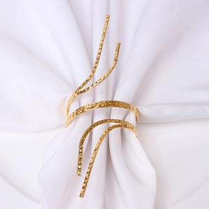Elegant gold metal napkin ring with hammered texture in spiral design for table decor