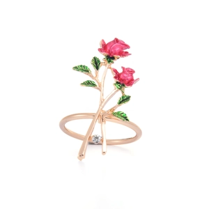 Elegant rose gold flower napkin ring with pink enamel petals and a sparkling diamond accent