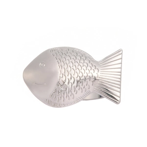 Silver metal fish-shaped napkin ring with detailed scale texture on white background