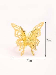 Detailed view of hollow butterfly napkin ring showing 7x7cm dimensions and gold plating