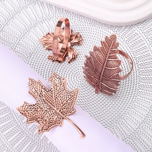 Rose gold maple leaf napkin rings set with detailed vein texture for elegant table decor