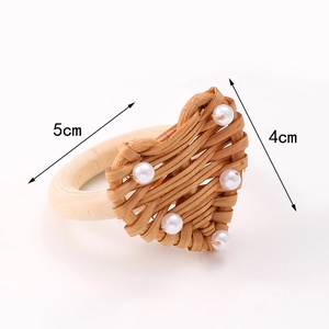 Handmade heart-shaped woven napkin ring with pearls and wooden base dimensions 5x4cm