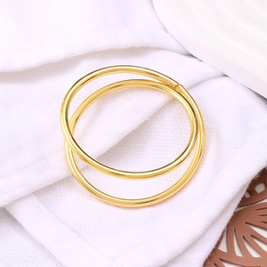 Elegant gold double ring napkin holder on white fabric for western table decoration