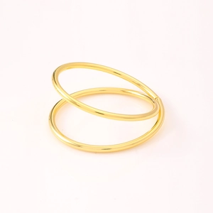 Polished gold double-layer zinc alloy napkin ring with a minimalist open circular design