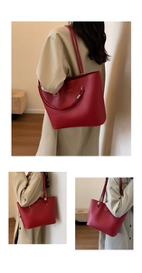 Détails du grand sac cabas en cuir rouge avec logo doré et porté épaule élégant