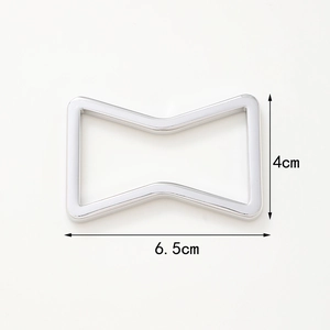Silver bow-tie metal napkin ring with 6.5cm width and 4cm height dimensions