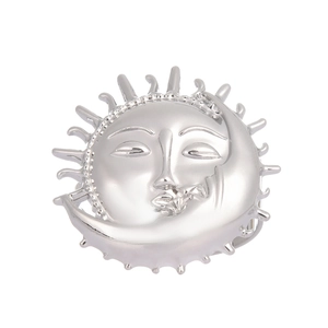 Polished silver metal napkin ring featuring sun and moon face design for table decor