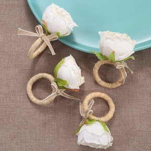 Set of 4 handmade woven napkin rings with white artificial roses and twine bows