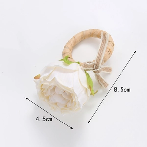 Handmade white rose napkin ring with woven rattan loop and burlap bow for wedding decor