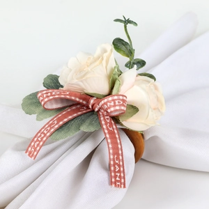 Elegant floral napkin ring with cream roses, red plaid ribbon and a natural wooden base