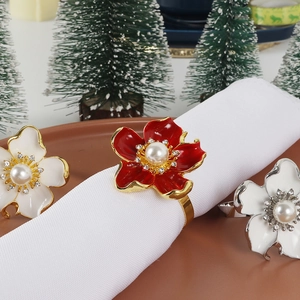Floral pearl napkin rings with red enamel petals and crystals for Christmas table decor