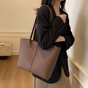 Brown leather tote bag with pebble texture, large capacity for daily commuting and school