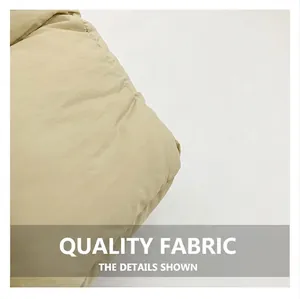 Close-up of beige quilted down-filled fabric showing soft texture and fine stitching
