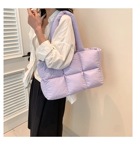 Quilted lavender puffer tote bag showing soft texture and spacious shoulder strap design