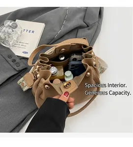 Interior view of light brown leather bucket bag showing spacious storage capacity