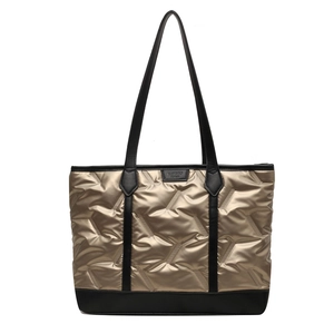 Champagne gold quilted tote bag with black handles and metal texture finish