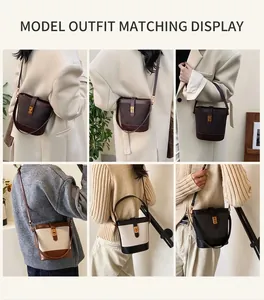 Detail shots of casual bucket bag in dark brown and beige leather with metal buckle