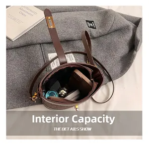 Internal capacity of vintage bucket bag showing space for phone and makeup