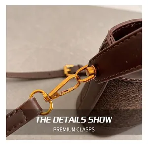 Close-up of golden swivel hook and leather stitching on leopard bucket bag